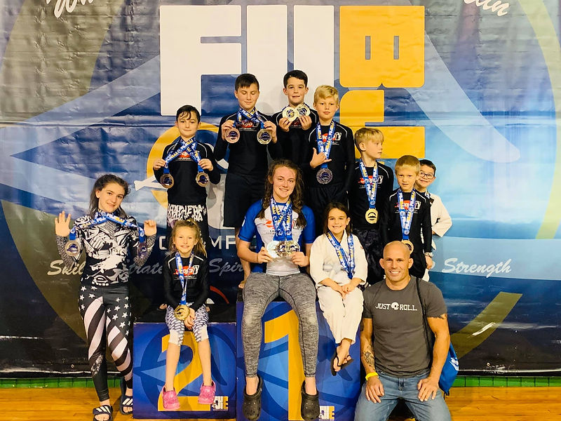 Dojo 1 youth team group photo with Coach Len